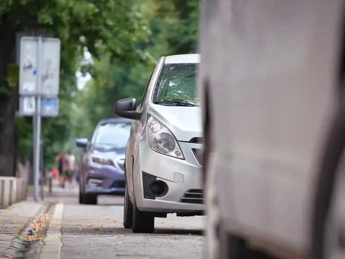 Buckeye illegal left turn accident attorney reviewing crash photos from a wide intersection near Verrado